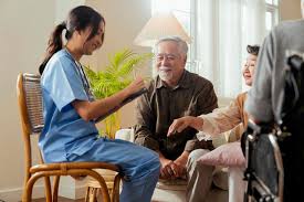 Caregiver chatting with elderly